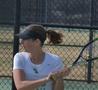 Photograph: [Ilona Serchenko holds racket backhanded]