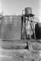 Photograph: [Wooden Oil Tank at Ada Belle Oil Field]