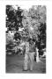 Photograph: [Lamar Fleming, Jr. informal snapshot with trees in background]