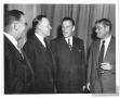 Photograph: [Lamar Fleming standing with three unidentified men]