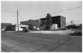 Photograph: [A Back View of Businesses on the West Side of 100 Block and S. Oak]