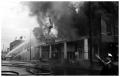 Primary view of [The Damron Hotel Fire, 18 of 21:   Individual in Front of the Burning Hotel]