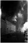 Primary view of [The Damron Hotel Fire, 17 of 21:   Two Individuals on the Street Northwest of the Fire]