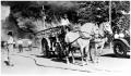 Photograph: [A Horse-Drawn Fire Wagon]