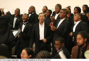 Primary view of [Choir members performing on stage]