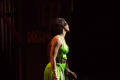 Photograph: [Performer in a green dress]