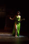 Photograph: [Performer in a green dress]
