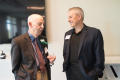 Primary view of [Ray Moseley talking with Man at A Century of Excellence Event]