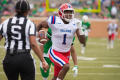 Thumbnail image of item number 1 in: '[LA Tech player running the ball]'.
