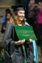 Photograph: [Graduate Student Posing with Diploma]