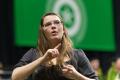 Photograph: [Sign Language Interpreter at Winter Commencement Ceremony]