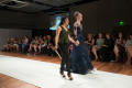 Photograph: [Design student walking with model down runway]