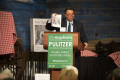 Photograph: [Neil Foote holding up Mayborn magazine while speaking at Soiree]