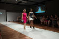 Photograph: [Design student and model walking down runway]