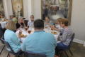 Photograph: [Attendees eating at table 1]
