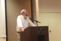 Photograph: [Rabbi David Zaslow at podium]