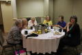 Photograph: [Attendees around table during breakfast]