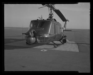 Primary view of object titled '[Photograph of a front view of a heavily armed UH-1C Iroquois helicopter]'.