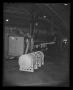 Photograph: [Photograph of fuel tank lifted into the UH-1A Iroquois helicopter]