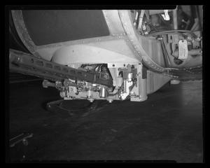 Primary view of object titled '[Photograph of a closeup of a gun on the front of a UH-1B Iroquois helicopter]'.