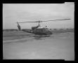 Primary view of [Photograph of a UH-1F Iroquois helicopter parked on a concrete surface, 4]