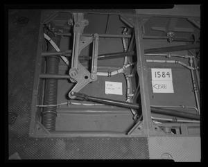 Primary view of object titled '[Photograph of wiring and tubing beneath the flooring of a UH-1B Iroquois helicopter, 2]'.