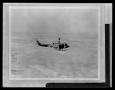 Thumbnail image of item number 1 in: '[Photograph of a YUH-1D Iroquois helicopter flying]'.
