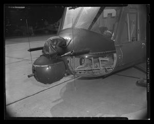 Primary view of object titled '[Photograph of a UH-1B Iroquois helicopter with a turret mounted to the front, 2]'.