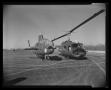 Photograph: [Photograph of the UH-1B Iroquois helicopter next to the "Iroquois Wa…