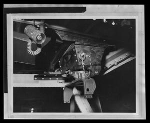 Primary view of object titled '[Photograph of a part attached to the ceiling of a UH-1B Iroquois helicopter]'.