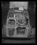 Photograph: [Photograph of a view inside an open compartment of a UH-1B Iroquois …