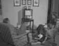 Primary view of [Two Children and Two Adults in a Living Room]