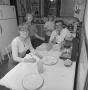 Photograph: [Coomes family in their kitchen, 6]