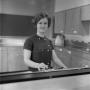 Photograph: [Kay Condron in a kitchen, 5]