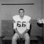 Photograph: [Football player sitting on a bench, 8]