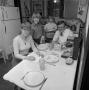 Photograph: [Coomes family in their kitchen]