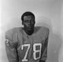 Photograph: [Football player sitting for a portrait, 25]