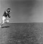Photograph: [Football player #34, Fredrick Glynn Hachtel, sprints holding the bal…