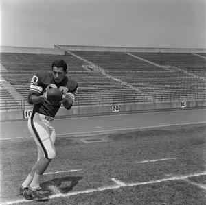 Primary view of object titled '[Football player number 80 catching a football]'.