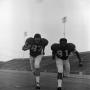 Photograph: [Two football players running, 12]