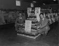 Primary view of [Two men with a Pepsi-Cola display]