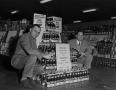 Photograph: [Two men with a Pepsi-Cola display, 2]