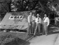 Photograph: [Four men in front of the WBAP tent at the Colonial Golf Tournament]