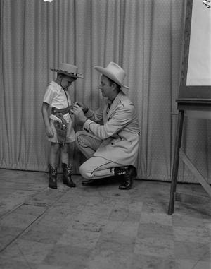 Primary view of object titled '[Jack Valentine with small boy]'.