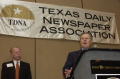 Photograph: [Wesley R. Turner speaking into microphone at TDNA conference, 2]