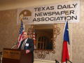 Thumbnail image of item number 1 in: '[Bill Hartman standing at podium giving speech at TDNA meeting]'.