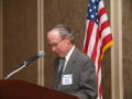 Photograph: [Gary Borders speaking into mic during TDNA award ceremony]