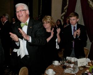 Primary view of object titled '[Patrick Canty and family clapping at TDNA awards]'.