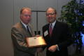 Photograph: [Jeremy L. Halbreich handing out award to Donnis Baggett]