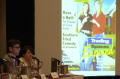 Photograph: [Jim Lenahan and Laura Gordon giving a presentation at a TDNA confere…